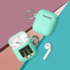A couple of airpods are next to each other