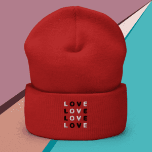 A small picture of a cuffed red Love beanie