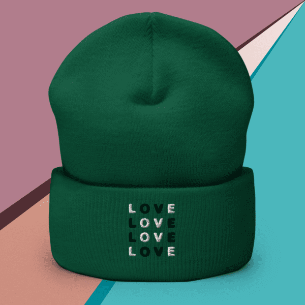 A small picture of a cuffed green Love beanie