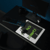 A small alien mouse pad on a desk