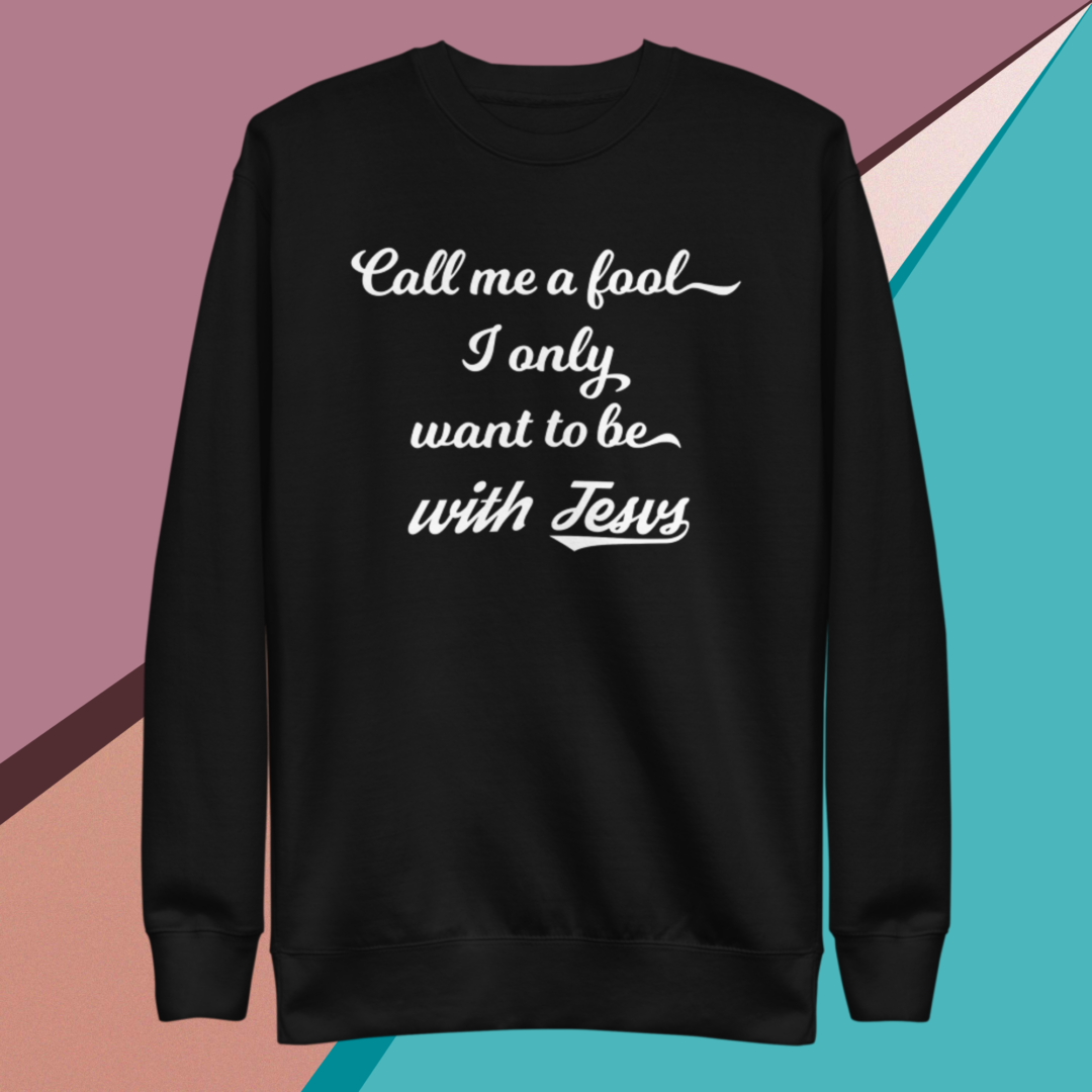 A small picture of a black sweatshirt saying call me a fool, I only want to be with Jesus