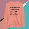 A pink sweatshirt with the words " everyone 's after love even my enemies ".