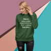 A woman wearing a green sweatshirt with the words " plan god."