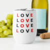 White wine tumbler near green grapes