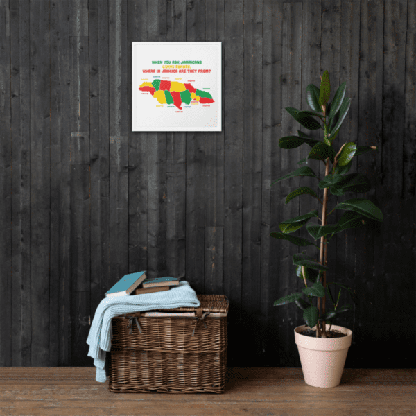 A map of Jamaica hanging on a wall near a potted plant