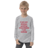 A young boy wearing a long sleeve shirt with the words " i am not always gaming sometimes i am asleep ".