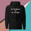 A black hoodie with the words are we human or are we coffee written on it.