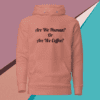 A pink hoodie with the words are we human or coffee ?