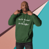 A man in a green hoodie with the words " are we there yet ?" on it.