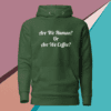 A green hoodie with the words are we human or are we coffee written on it.