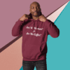 A man in a maroon hoodie with the words " are we human ?" and " are we coffee ".