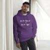 A man in black pants and purple hoodie.