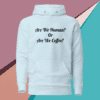 A white hoodie with the words are we human or are we coffee written on it.