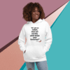 A woman is wearing a white hoodie with a quote.
