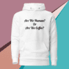 A white hoodie with the words are we human or are we coffee ? written on it.