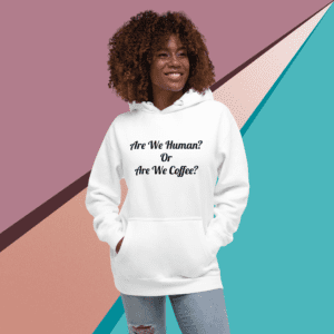 A woman standing in front of a white wall.