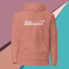 A pink hoodie with the word blessed written on it.
