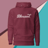 A maroon hoodie with the word blessed written on it.