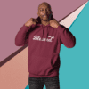 A man in a maroon hoodie with the word blessed on it.