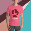 Person wearing a pink t-shirt with a unique abstract design and text.