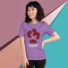 Woman wearing a purple graphic t-shirt with abstract shapes.