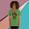 Woman smiling wearing a green t-shirt with a red abstract design.