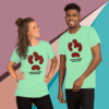 Two people wearing matching green t-shirts with a puzzle piece design.