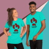 Two people wearing matching turquoise t-shirts with a red abstract design.