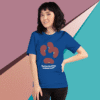 Woman wearing a blue T-shirt with a paw print design and text.