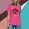 Woman wearing a pink T-shirt with a cute monkey design and text.