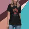 A woman wearing a black T-shirt with a design of kidneys and the text.