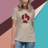 Cream t-shirt with a red paw print and dog-related text.