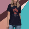 Woman wearing a navy blue t-shirt with a red kidney illustration.