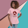 Smiling woman wearing a playful pink t-shirt with a quirky kidney bean design.