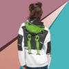 Person wearing a hoodie with a backpack featuring two green alien designs.