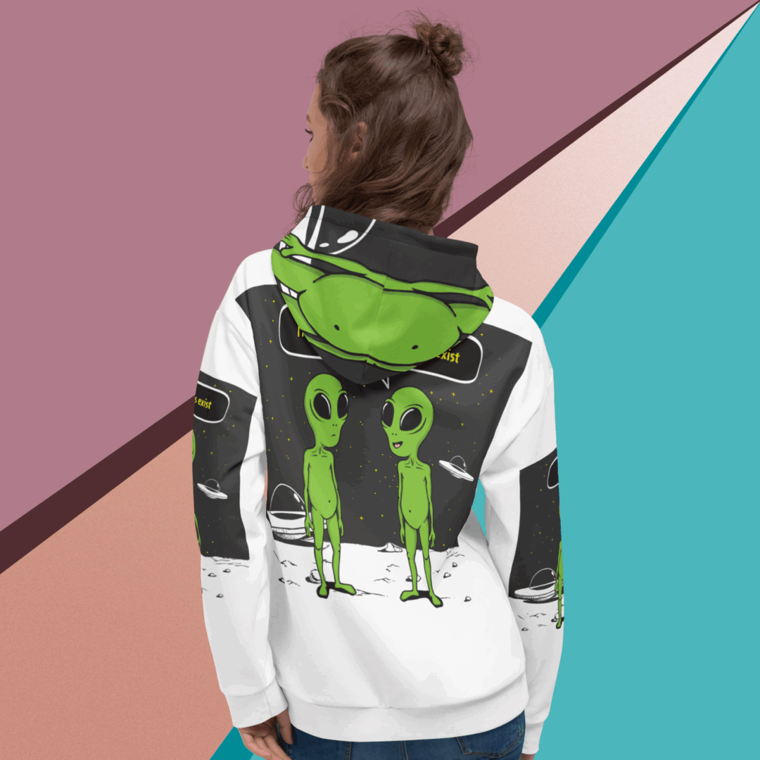 Person wearing a hoodie with a backpack featuring two green alien designs.