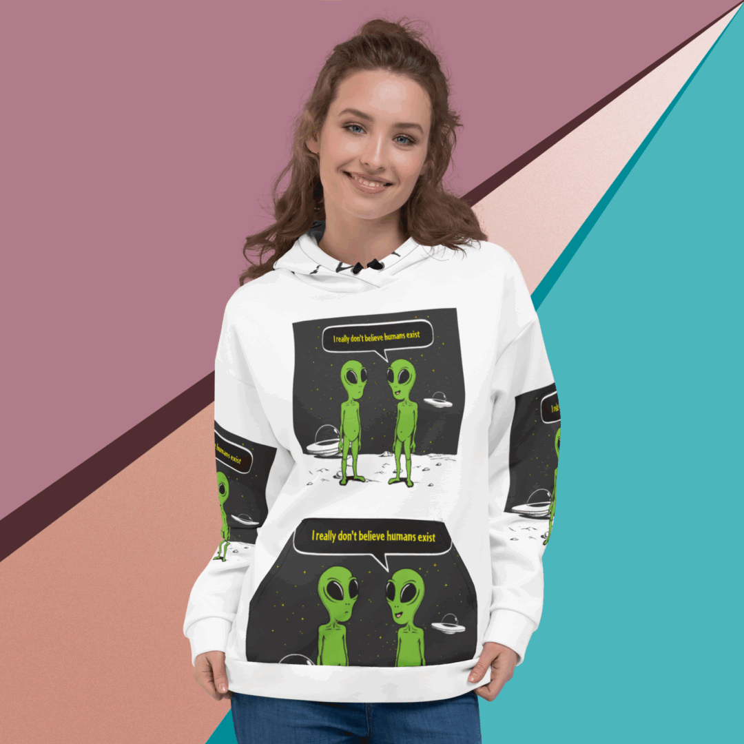 Young woman wearing a white hoodie with green alien designs.