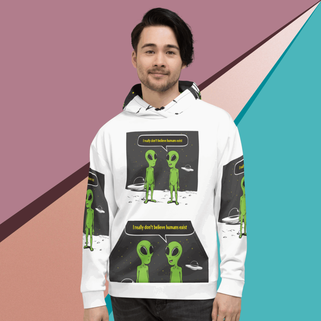 Man wearing a white hoodie with green alien graphics and text.