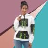 Woman wearing a white hoodie with green alien designs.