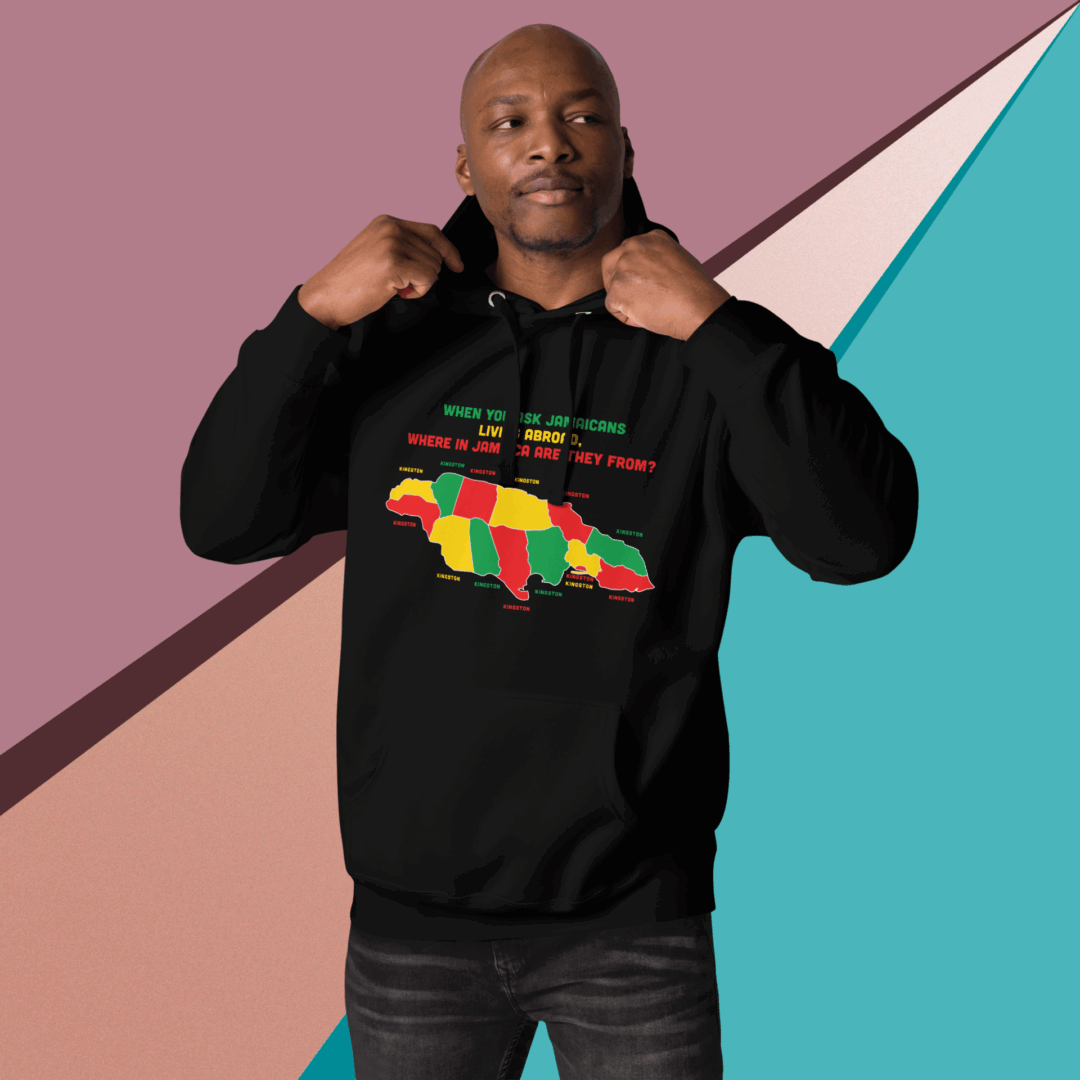 Man in a black hoodie with colorful Africa map design posing against a geometric background.
