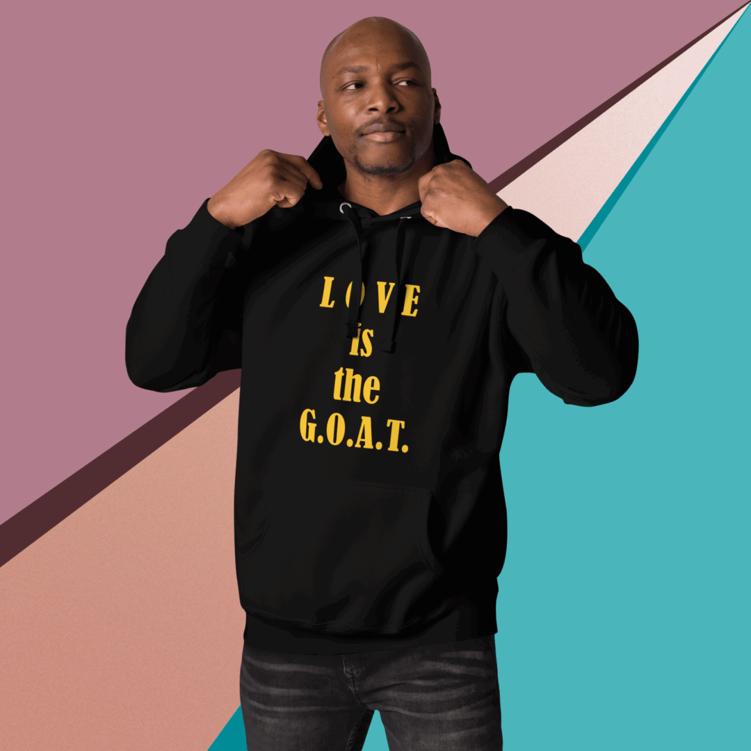 Man pointing to his black hoodie with inspirational gold text.
