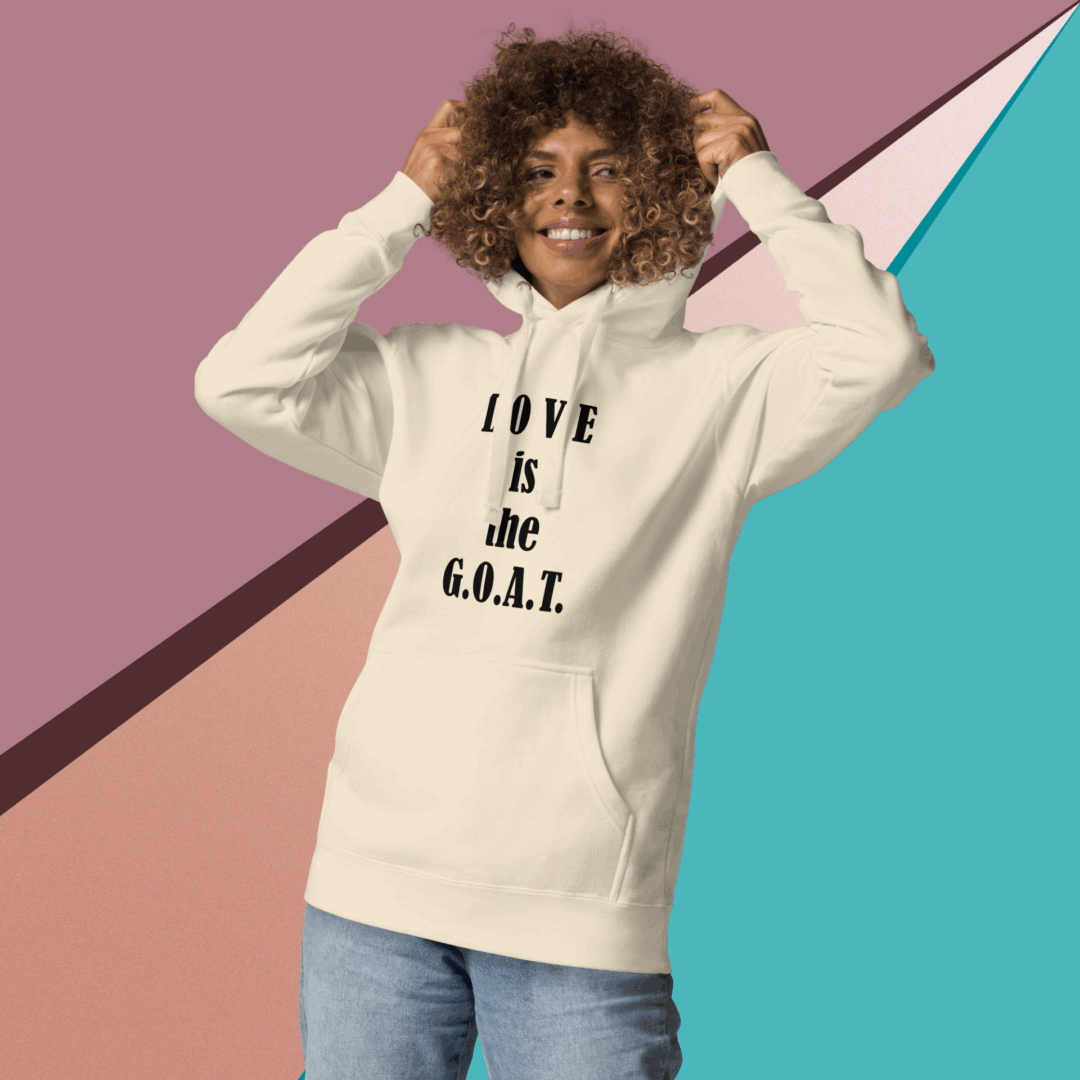 Person wearing a hoodie with the text 'LOVE IS REAL' on it.