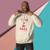 Man wearing a hoodie with the text 'LOVE is the G.O.A.T.'