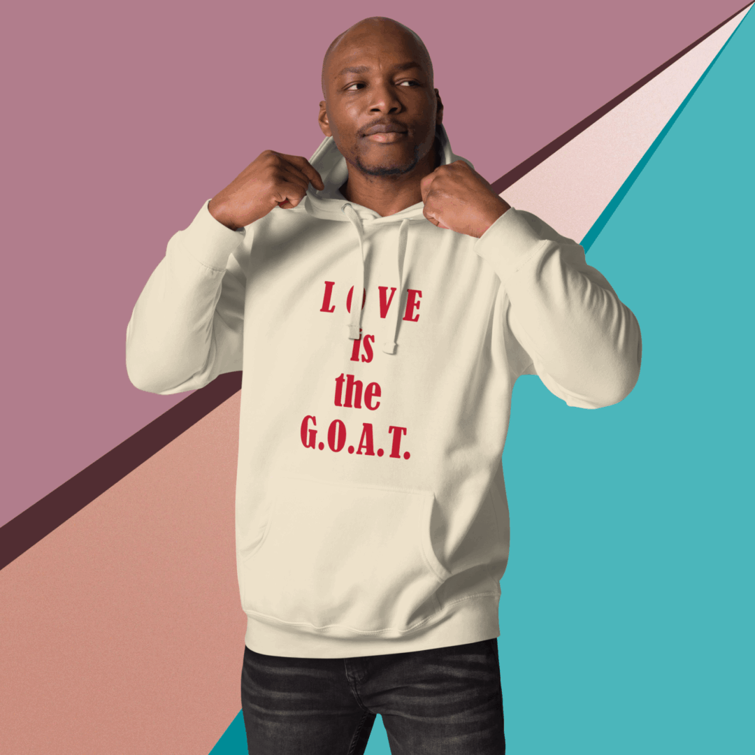 Man wearing a hoodie with the text 'LOVE is the G.O.A.T.'