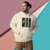 Man in beige hoodie with graphic print posing against a colorful geometric background.