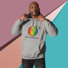 cotton-heritage-m2580-i-unisex-premium-pullover-hoodie-carbon-grey-front-68e3264680467 Man wearing a gray hoodie with a colorful graphic and text.