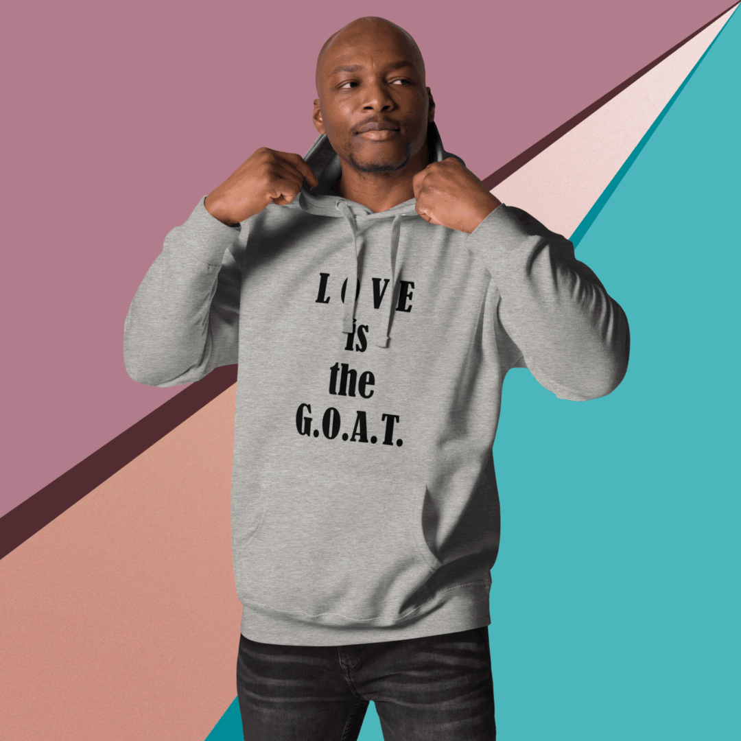 Man wearing a gray hoodie with text on it.