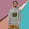 Man wearing a gray hoodie with a colorful graphic design, smiling against a geometric background.