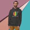 Man smiling in a colorful hoodie against geometric background.
