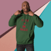 Man wearing green hoodie with 'Life of the G.O.A.T.' text.